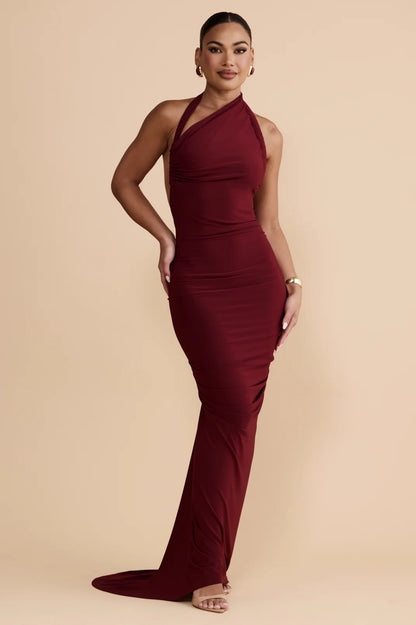 Abito EVA Un’espressione di eleganza moderna, questo abito senza schiena si distingue per la sua versatilità scultorea e per i dettagli curati. La scollatura multi-way consente uno styling personalizzato, offrendo più silhouette in un unico design